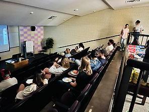 Students gathering together to watch a movie.